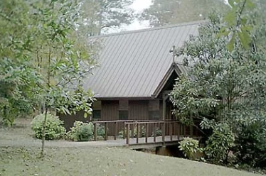 Wooden church nestled among the trees